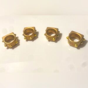Four Gold Studded Ceramic Napkin Rings with Beige Napkins
